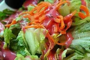 Photo: Green salad with vinaigrette. CC--elvissa. Photo: Green salad with raspberry vinaigrette. CC--elvissa.